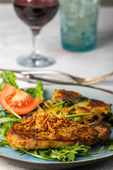 grilled pork steak on lambs lettuce