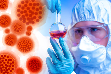 A microbiologist examines a chemical liquid in a flask against the background of 2019-nCoV...