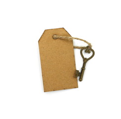 key and a piece of recycled paperboard with space for text . love message. key ties with rope