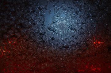 frozen window with ice.texture with red and blue highlights.noise in the photo