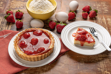 Homemade strawberry pie with and a golden crust, on wooden background