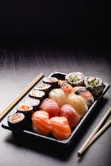 Tuinposter Sushi to go concept. Takeaway box with sushi © DMegias