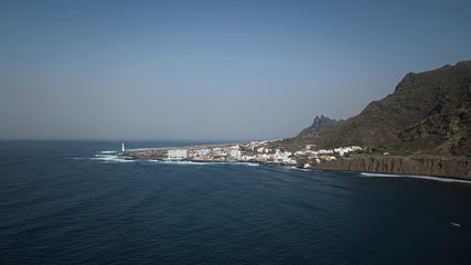 The coast of the ocean and mountains. Top view of the city of Punta del Hidalgo Canary Islands. Sunny day. Travel to the beautiful places of the planet Earth.