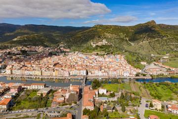 aerial view of bosa town with his colored houses and the castle in background