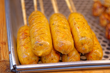 Grilled sausages on sticks