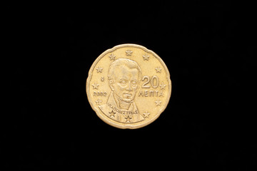 Greek 20 Euro Cent coin from 2002, obverse showing portrait of Ioannis Capodistrias. Isolated on black background