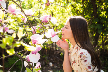 Beautiful woman face with magnolia. Beauty sensual girl.