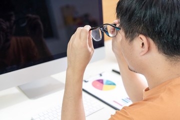 Tired Asian men work at home