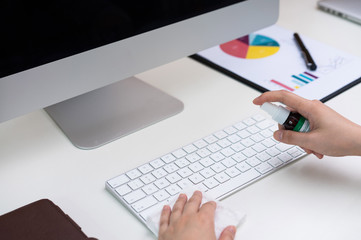 Asian women clean office electronic equipment