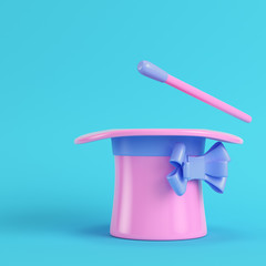Top hat and magic wand on bright blue background in pastel colors © Andrey Kudrin