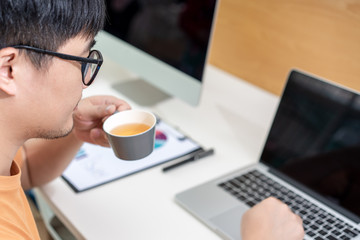 Home office scene of young Asian men