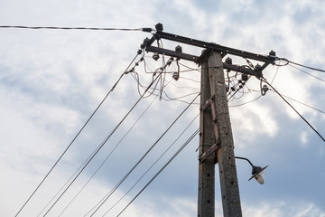 Old power electric line and a Street Lamp, with a power supply cable, made of an obsolete...