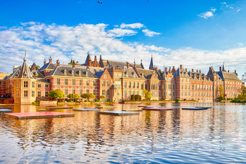 Binnenhof Palace of Parliament inThe Hague in The Netherlands At Daytime. Against Modern Skyscrapers on Background.