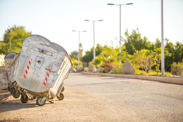 Old metal garbage cans made of gray aluminum.