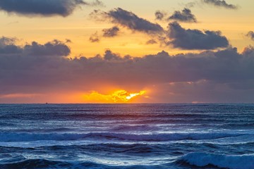Obraz na płótnie Canvas Seaside Ocean Sunset With Boat