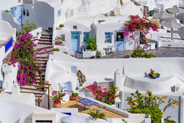 Obraz na płótnie Canvas Traditional white buildings facing Aegean Sea in Oia, Santorini island, Greece