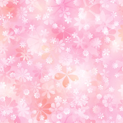 Spring seamless pattern of various flowers in pink and peach colors