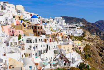 Fototapeta premium Traditional white buildings facing Aegean Sea in Oia, Santorini island, Greece