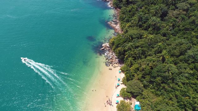 Seascape view in Paraty, Rio de Janeiro, Brazil. Jet ski surfing on the beach. Seascape in Paraty, Rio de Janeiro, Brazil. Jet ski surfing on the beach. Seascape view. Jet ski surfing on the beach.
