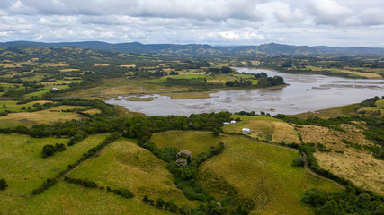 Fototapeta na wymiar Aerial view of wetland surrounded by meadows