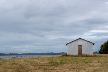 Fototapeta na wymiar A small warehouse on a farm at Chiloe Island, Chile