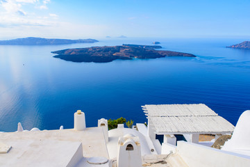 White buildings and hotels with panoramic view of Aegean Sea in Fira, Santorini, Greece
