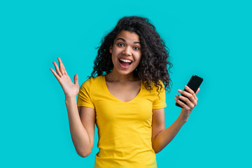 Portrait of attractive young african american girl using mobile phone