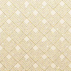 Art deco seamless pattern with gold rhombus tiles scales and golden sparkle texture.