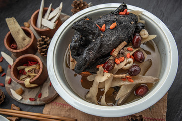 Chinese traditional nourishing health stew, stewed black bone chicken, Chinese black chicken soup,...