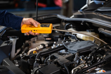 Fototapeta na wymiar mechanic hand check for leaks in GAS LPG gasoline in car