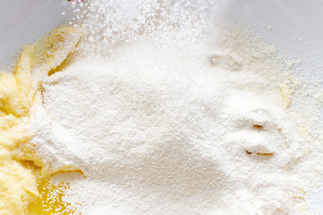 Process sifting flour through a baking sieve