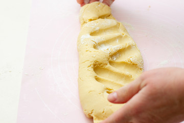 the process of making dough by hand in the kitchen