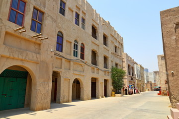 Fototapeta na wymiar Old Dubai of buildings and traditional Arabian streets. Historical Al Fahidi neighborhood, Al Bastakiya in in Dubai.