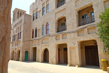 Fototapeta na wymiar Old Dubai of buildings and traditional Arabian streets. Historical Al Fahidi neighborhood, Al Bastakiya in in Dubai.