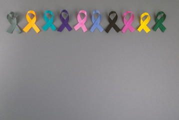 Different ribbons, symbols of cancer, cancer awareness month.  Copy space for your text.