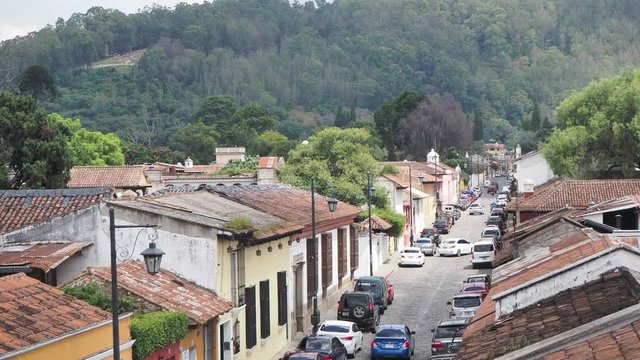 Guatemala, Antigua. traffic in a town cobbled street