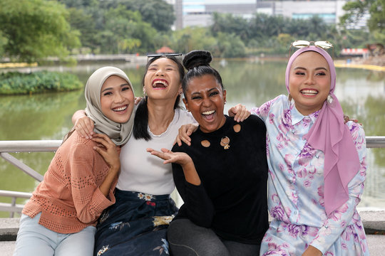 Group of woman Malay Chinese Indian Asian outdoor green park lake nature happy laugh smile mingle