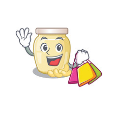 A friendly rich cashew butter waving and holding Shopping bag