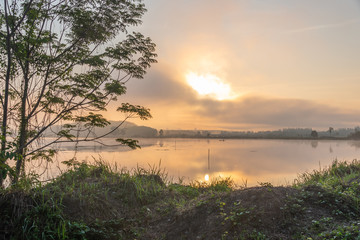 Fototapeta na wymiar Morning nature scene, sky, clouds and fog (mist) on the lake