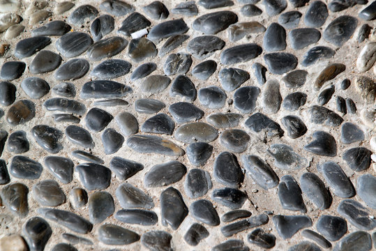 Stone paving background - granite cobblestone pattern in Pattay, Thailand..