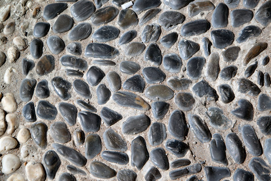 Stone paving background - granite cobblestone pattern in Pattay, Thailand..