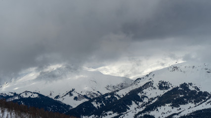 Image of a mountain covered with a snow cloud.