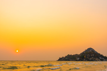 Beautiful tropical nature of sea beach ocean at sunset or sunrise time