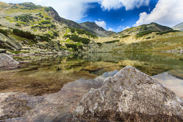 Fototapeta na wymiar Gorgeous scenery in the Alps in summer, with a beautiful glacier lake