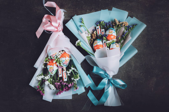 Sweet edible bouquet arrangement gifts from Kinder Surprise, chocolate egg with small toy for children. How to Make edible candy sweet Bouquet Steps, tutorial. Kropivnitskiy, Ukraine, January 7, 2020
