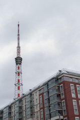 Obraz premium A residential house built on modern technologies. Radio-TV-transmitting object behind the house.
