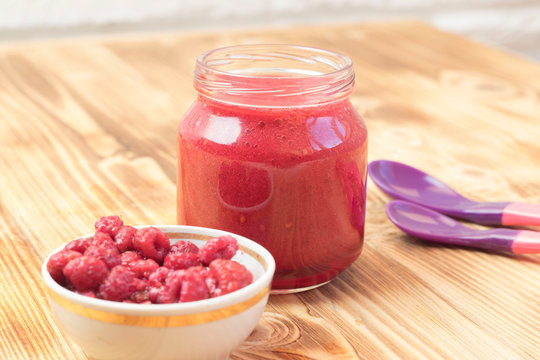 Baby Raspberry Puree In A Jar. Baby Food.