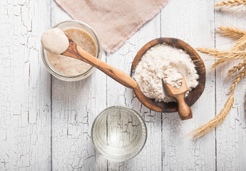 The leaven for bread is active. Starter.sourdough ( fermented mixture of water and flour to use as...