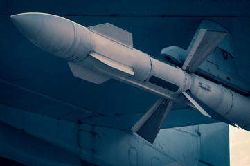 combat missile under the wing of the aircraft close-up