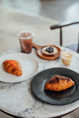 Croissant and Drink Menu on Table Cafe Hopping Time
